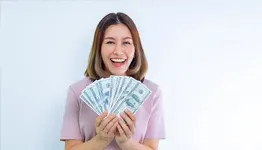 Lady holding bank notes